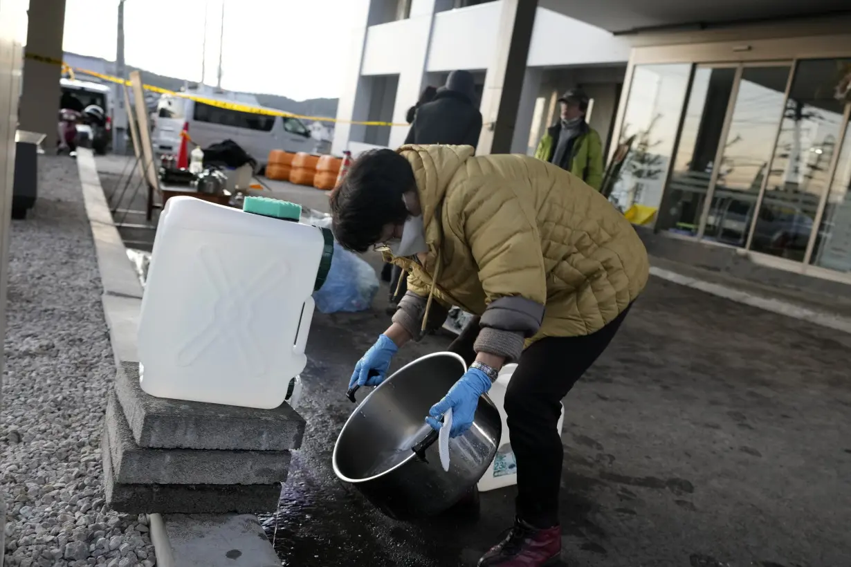 Scenes of loss play out across Japan's western coastline after quake kills 92, dozens still missing