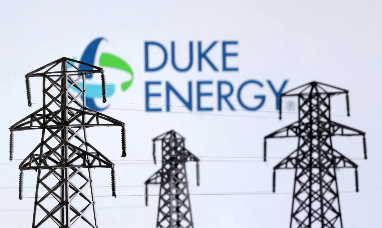 FILE PHOTO: Illustration shows Electric power transmission pylon miniatures and Duke Energy logo