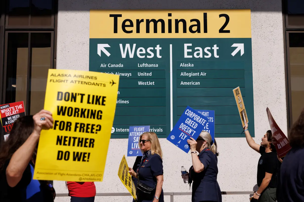 Flight attendants join hands to picket outside 30 airports for better pay