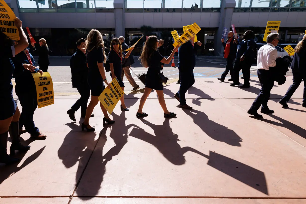 Flight attendants join hands to picket outside 30 airports for better pay