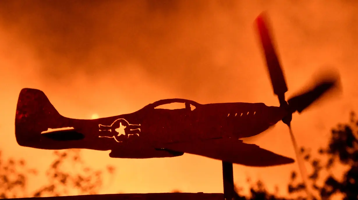 An airplane weather-vain propeller spins from the heavy winds from the Thomas Fire in the hills outside Montecito California