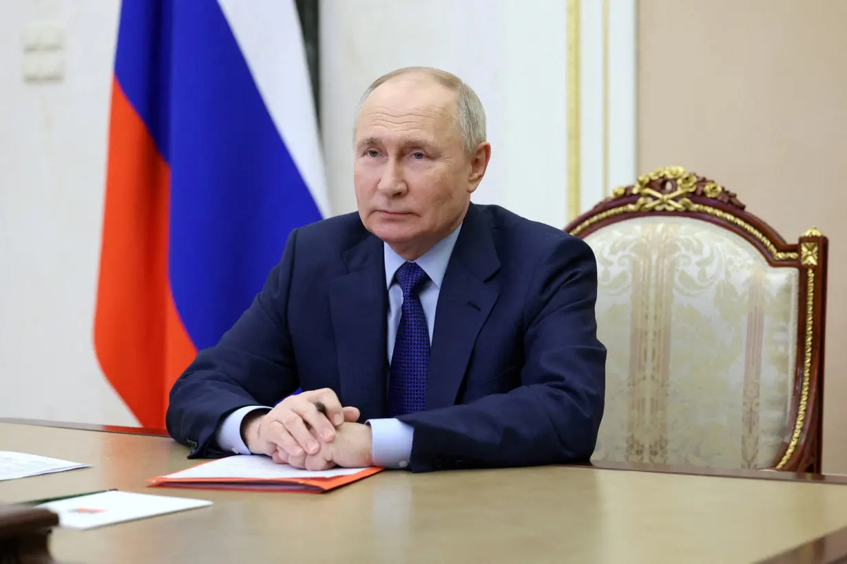 FILE PHOTO: Russian President Putin chairs a meeting with members of the Security Council via video link in Moscow