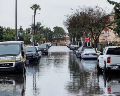 Pacific storm douses California, flooding roads, in first of one-two punch