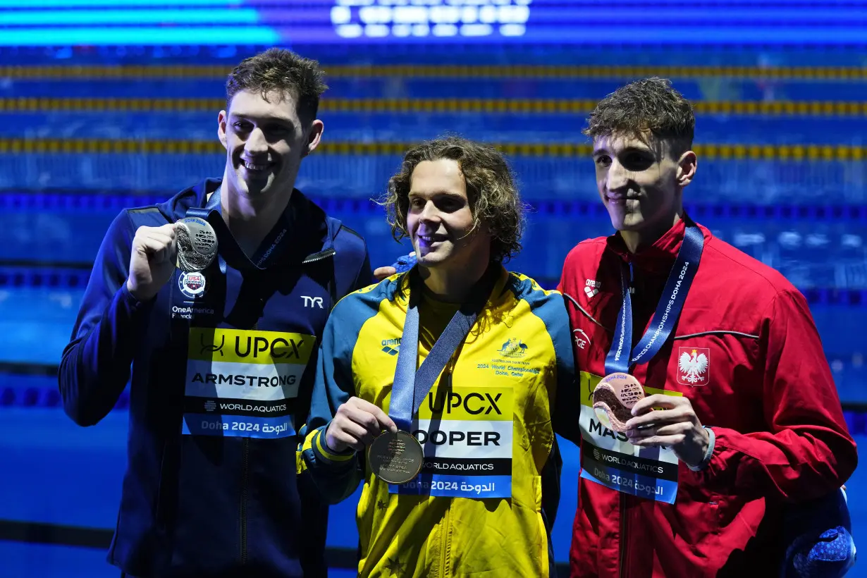 American Hunter Armstrong gets 2 more medals on final day of swim worlds. Israeli swimmer is jeered