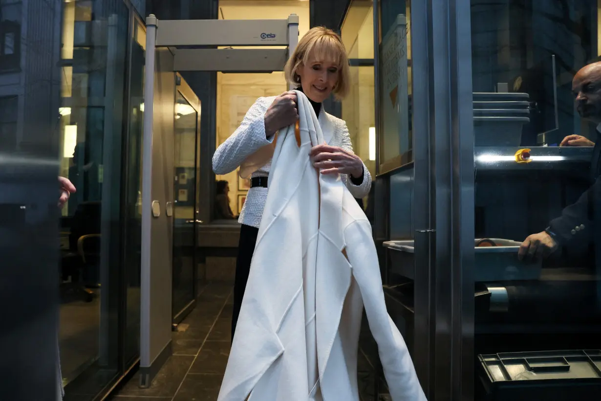 E. Jean Carroll walks outside the Manhattan Federal Court, in New York City