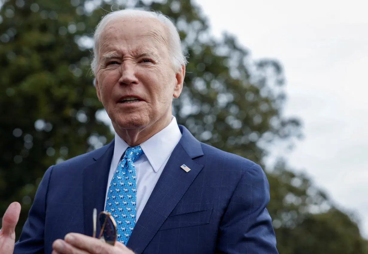 U.S. President Joe Biden speaks to the media before he departs the White House, in Washington