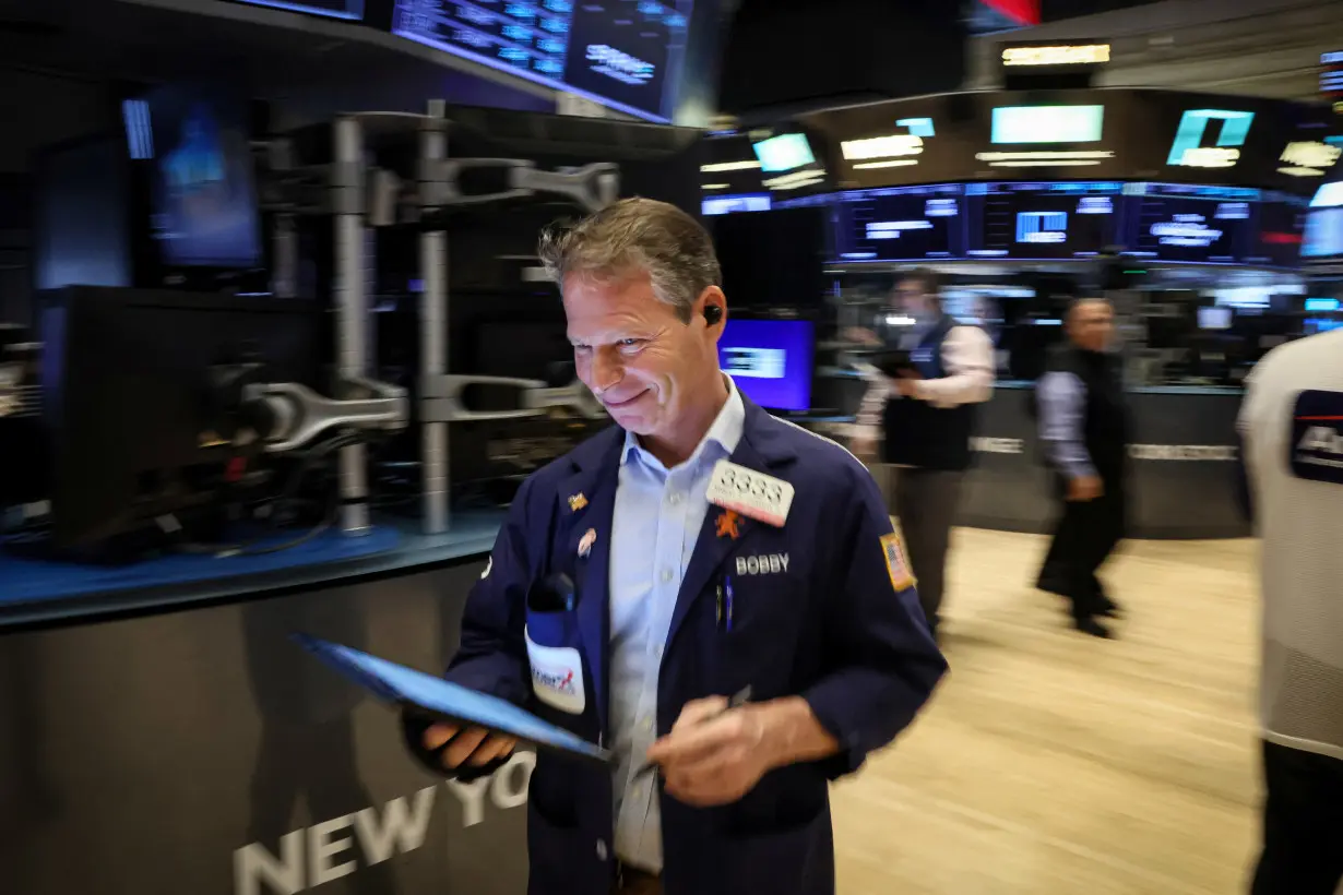 Traders work on the floor of the NYSE in New York