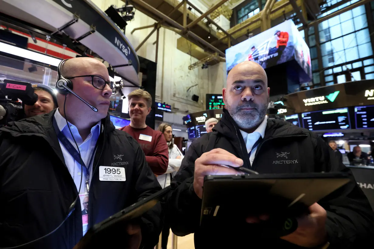 Traders work on the floor of the NYSE in New York