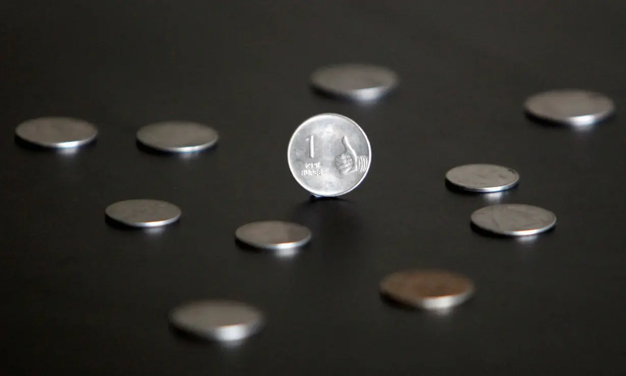 FILE PHOTO: An Indian one rupee coin is seen in this picture illustration taken in Mumbai