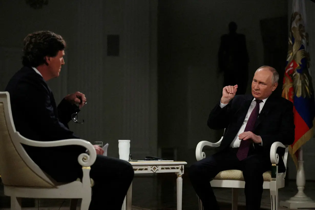 FILE PHOTO: Russian President Vladimir Putin gives interview to U.S. television host Tucker Carlson in Moscow