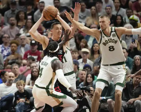 Tatum has 26 points and Celtics withstand late rally to beat Heat 110-106