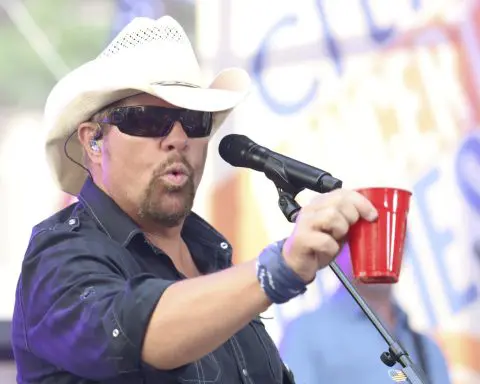 Fans raise a red Solo cup to honor Toby Keith, who immortalized the humble cup in song