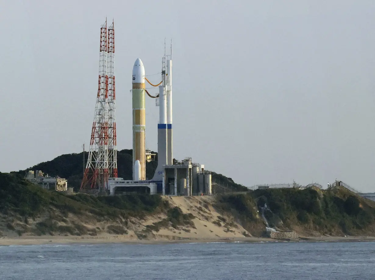 FILE PHOTO: An H3 rocket carrying a land observation satellite is seen before its launch at the Tanegashima Space Center, Japan