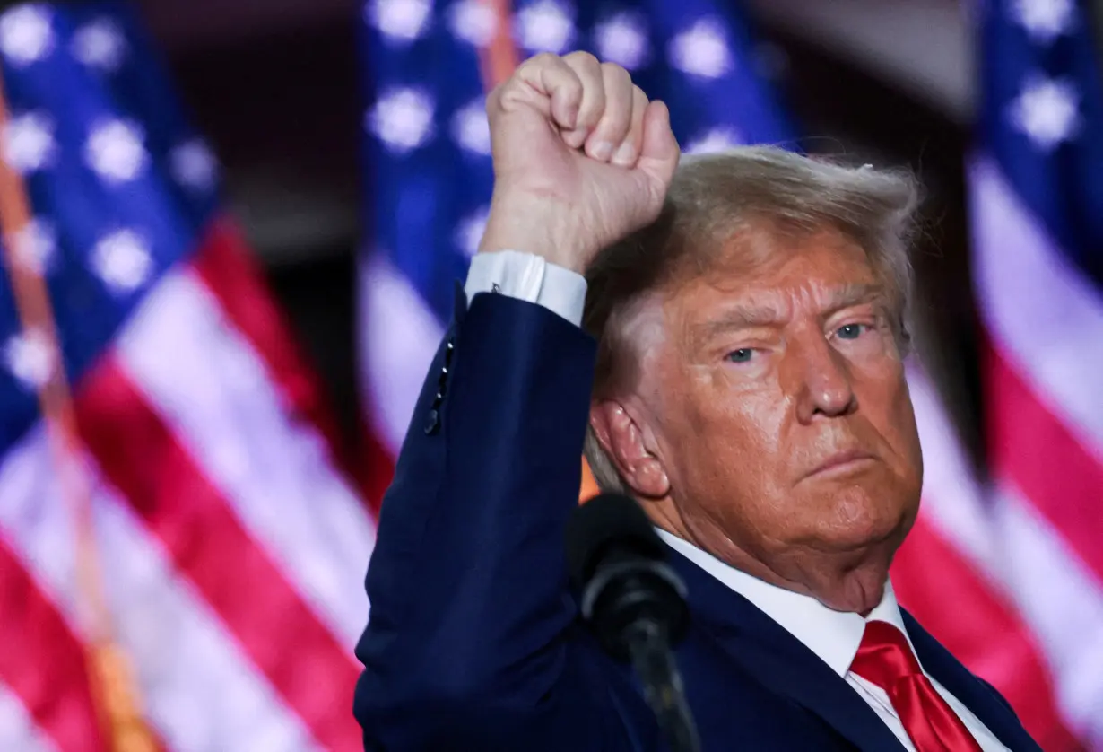 Former U.S. President Donald Trump gestures during an event following his arraignment on classified document charges, in Bedminster