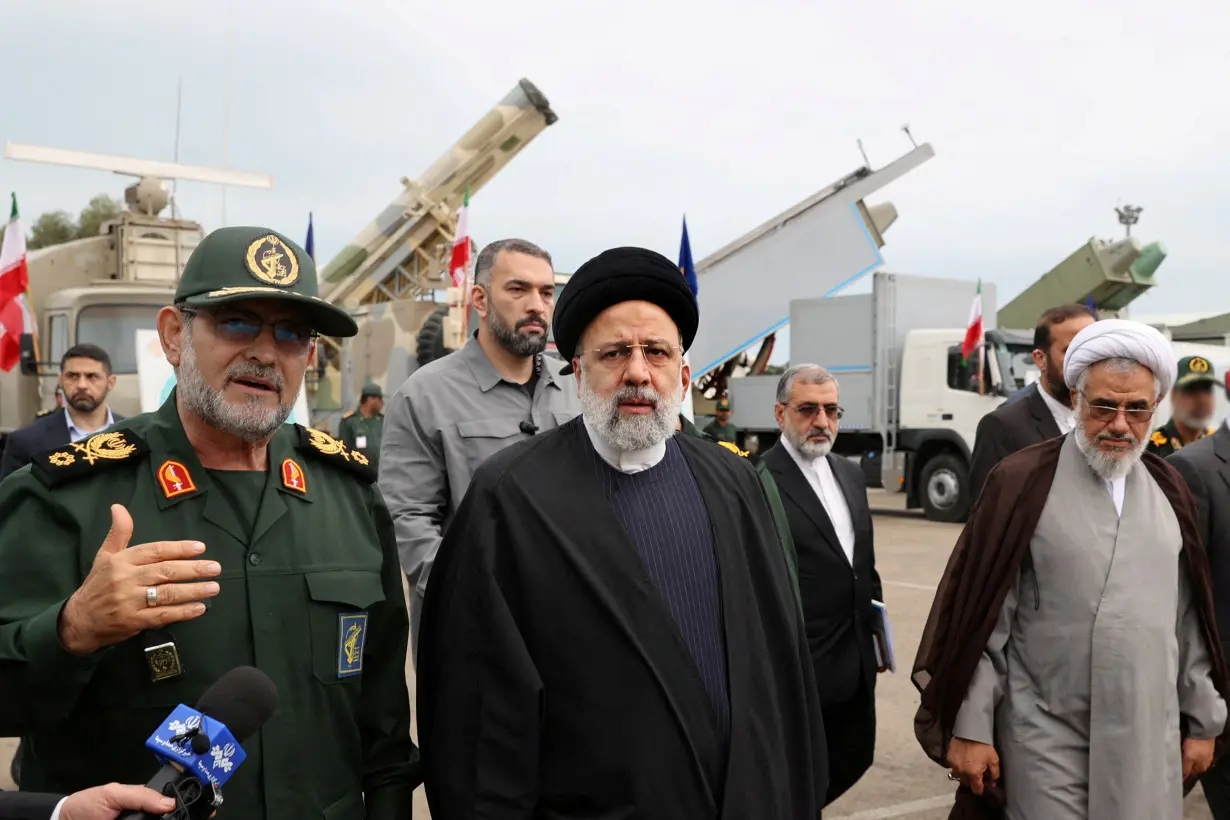 FILE PHOTO: Iranian President Ebrahim Raisi inspects military equipment at a Revolutionary Guards naval site in Bandar Abbas