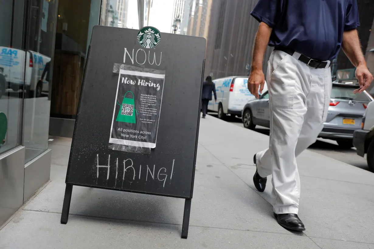 FILE PHOTO: A sign advertising job openings is seen outside of a Starbucks in Manhattan, New York City, New York