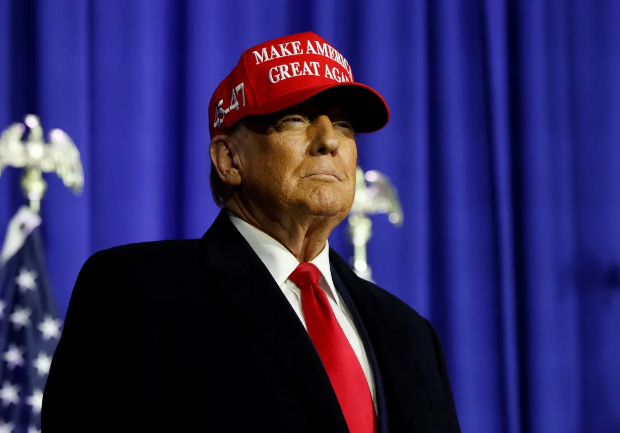 Former U.S. President Donald Trump looks on at a campaign event in Waterford Township, Michigan