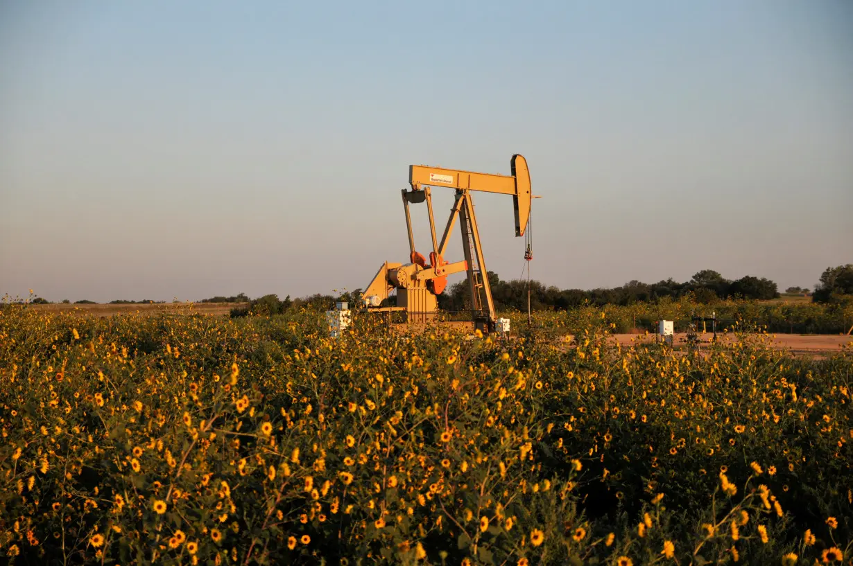 FILE PHOTO: A pump jack operates at a well site leased by Devon Energy Production Company near Guthrie, Oklahoma