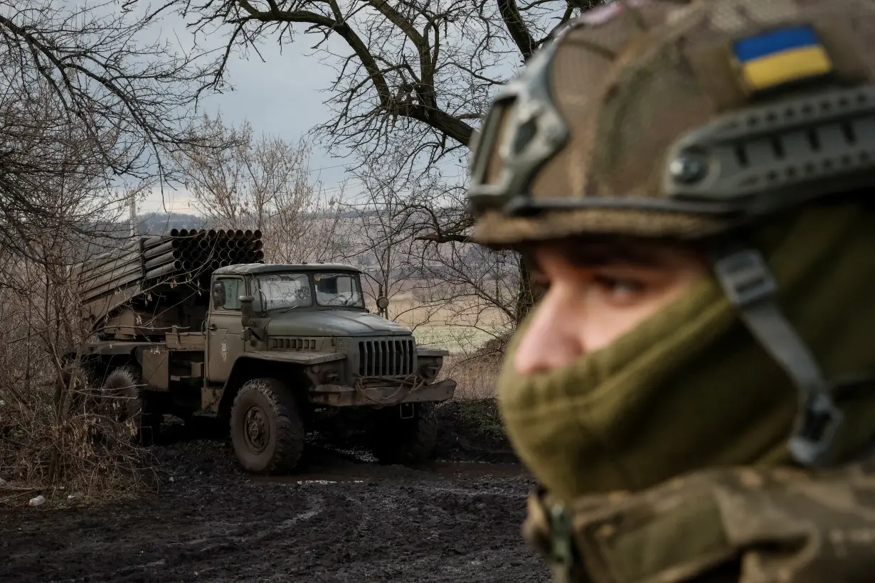 Ukrainian servicemen fire a BM-21 Grad multiple launch rocket system towards Russian troops in Donetsk region