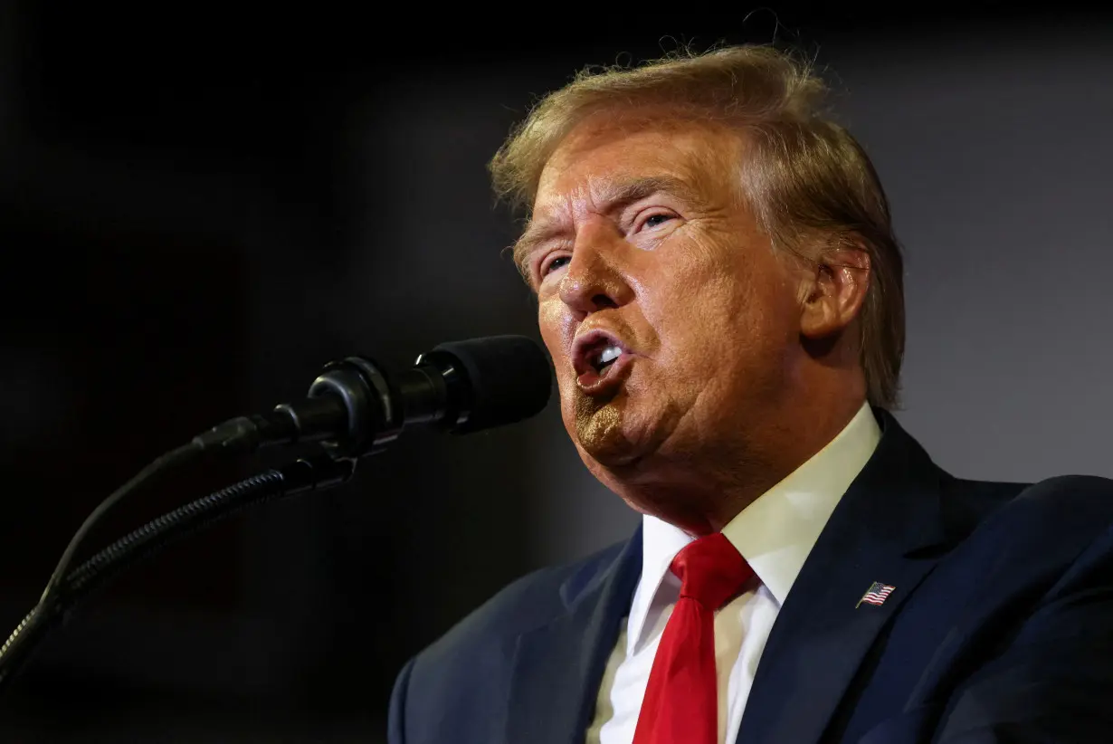 FILE PHOTO: Former U.S. President Donald Trump attends a campaign event in Conway