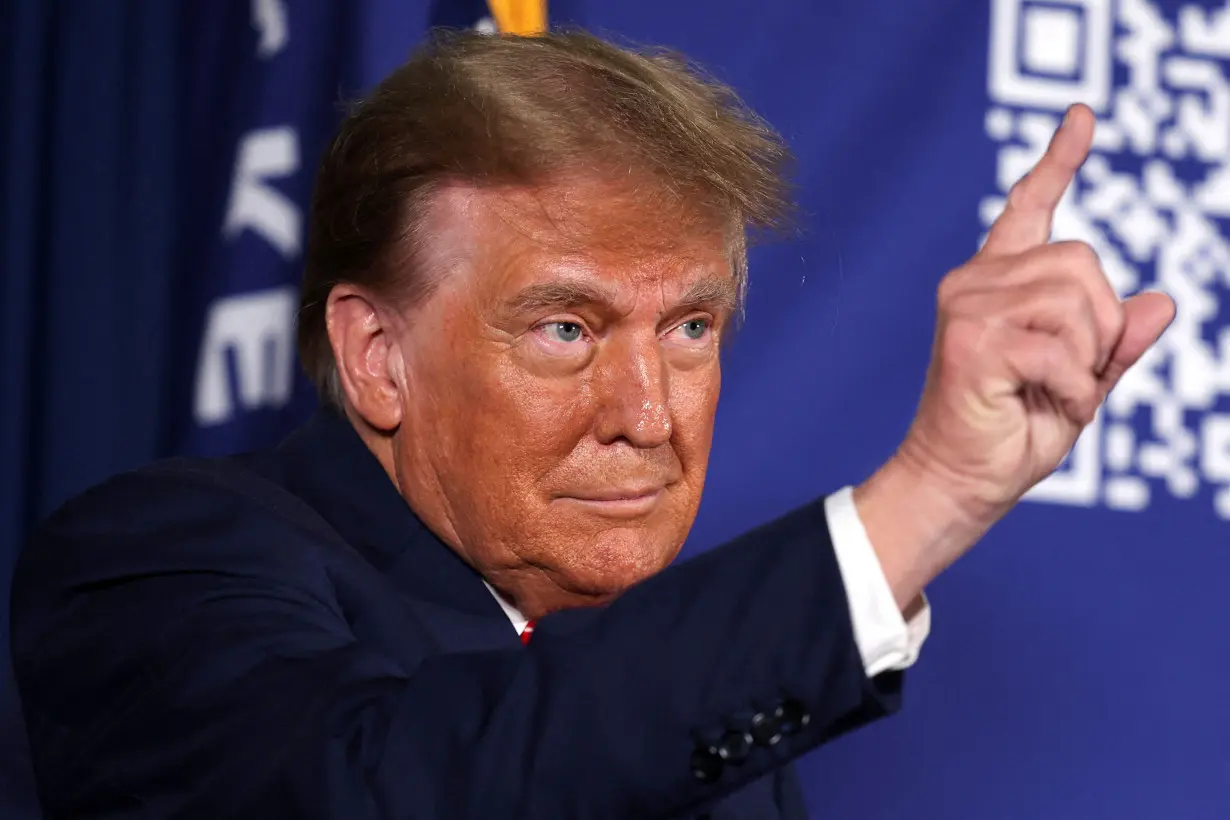 FILE PHOTO: Former U.S. President and Republican presidential candidate Donald Trump holds a rally in advance of the New Hampshire primary election in Laconia