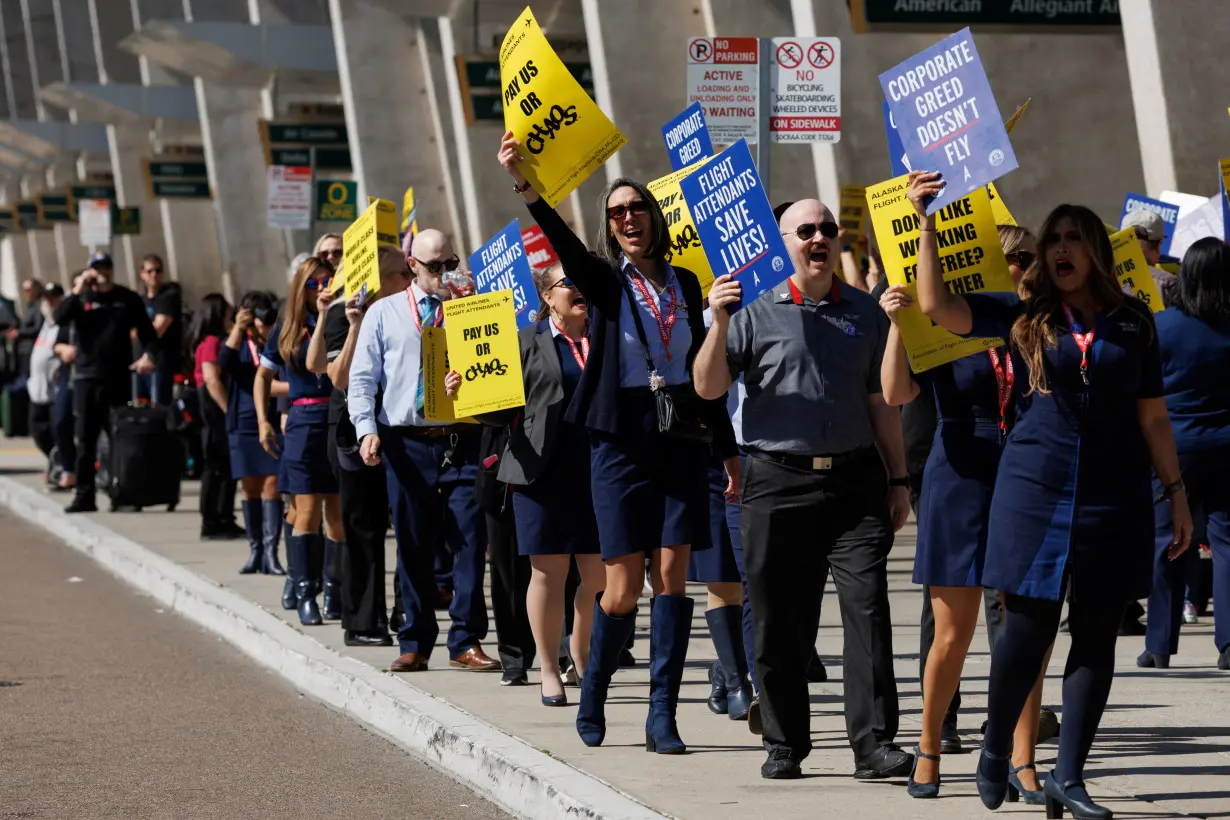 Flight attendants join hands to picket outside 30 airports for better pay