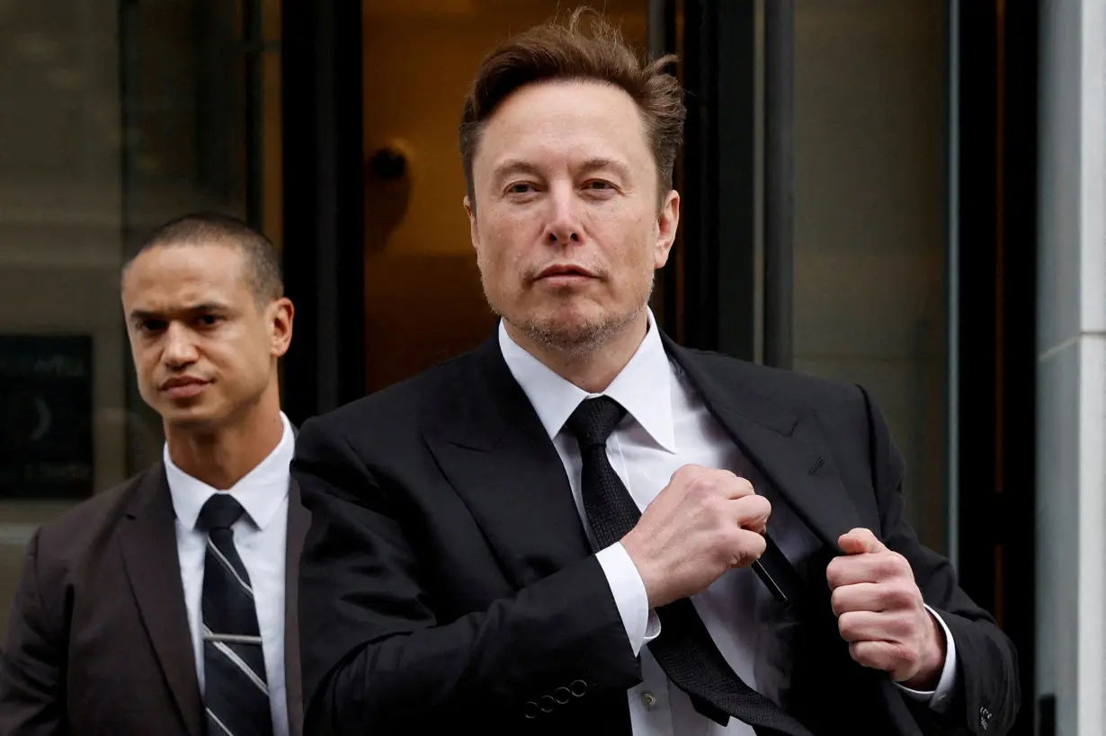 FILE PHOTO: Tesla CEO Musk departs the company’s local office in Washington