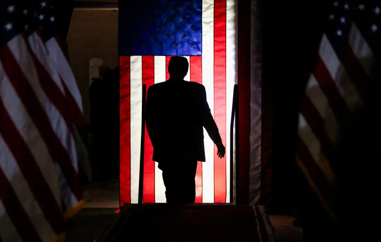 FILE PHOTO: Former U.S. President Donald Trump attends a campaign event in Conway