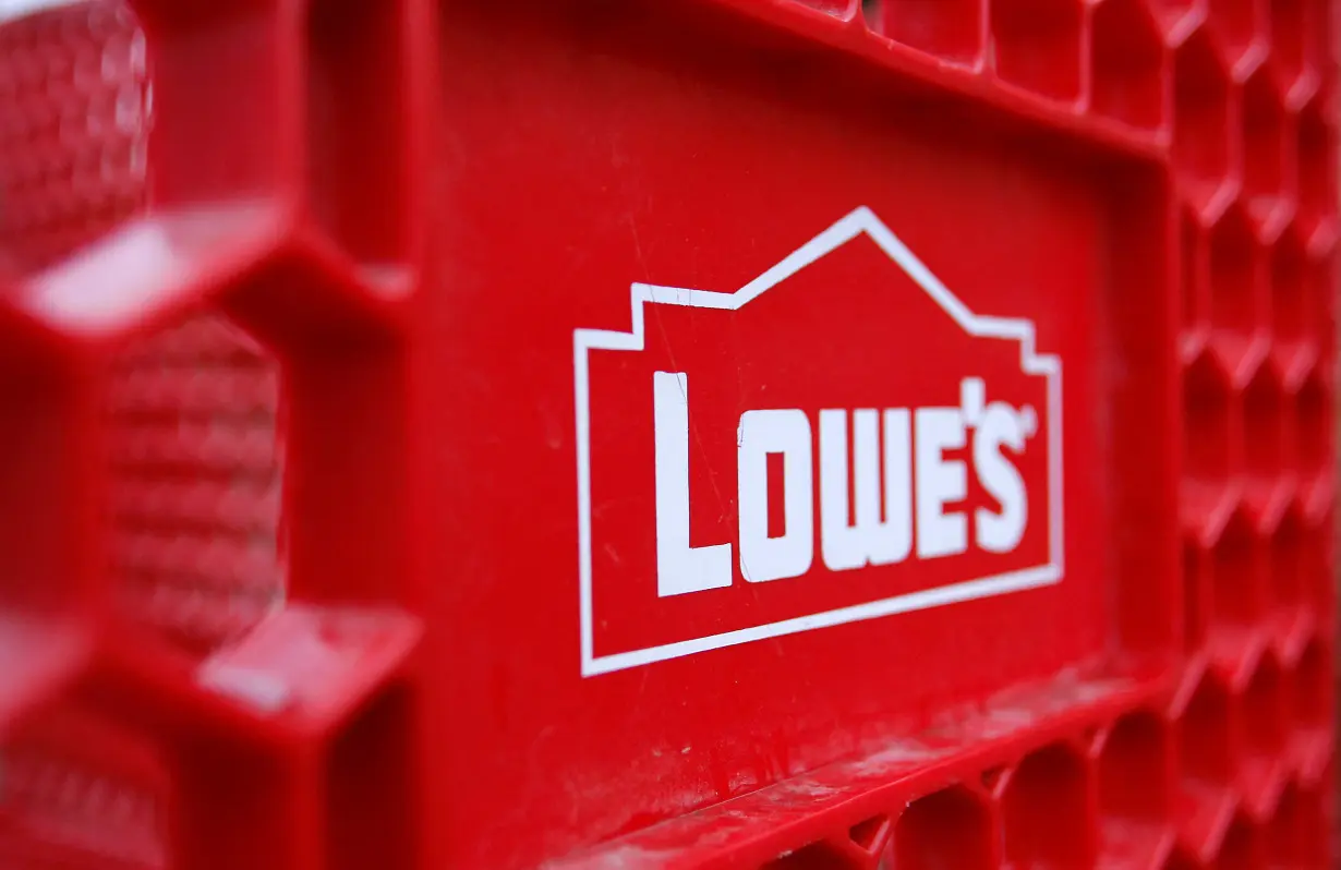 FILE PHOTO: The Lowes logo is displayed on a shopping cart outside of a store in Scottsdale