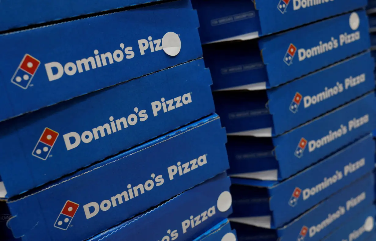 FILE PHOTO: Domino's pizza boxes are pictured inside a restaurant in Noida