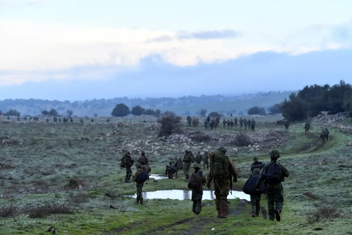 Israeli soldiers take part in training session near the Israel border with Syria at the Israeli-occupied Golan Heights