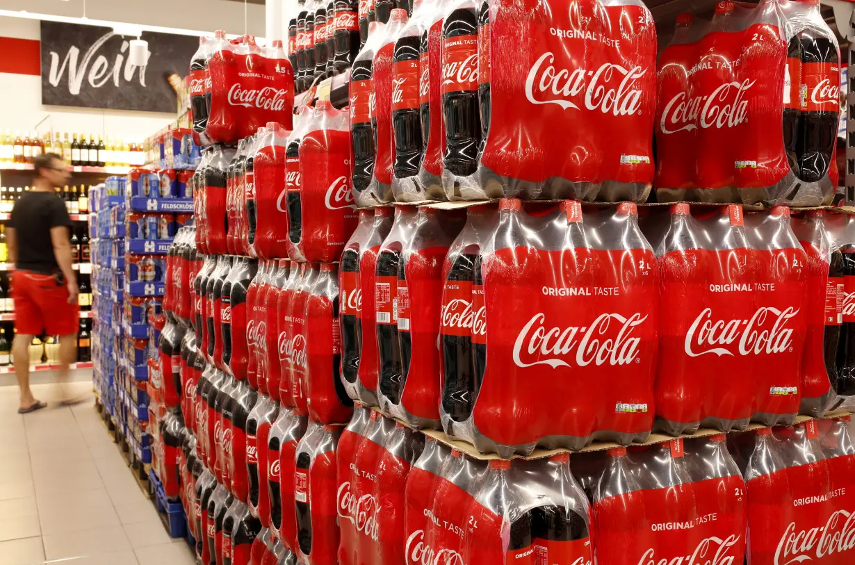 Bottles of Coca-Cola are displayed at a supermarket of Swiss retailer Denne in Glattbrugg