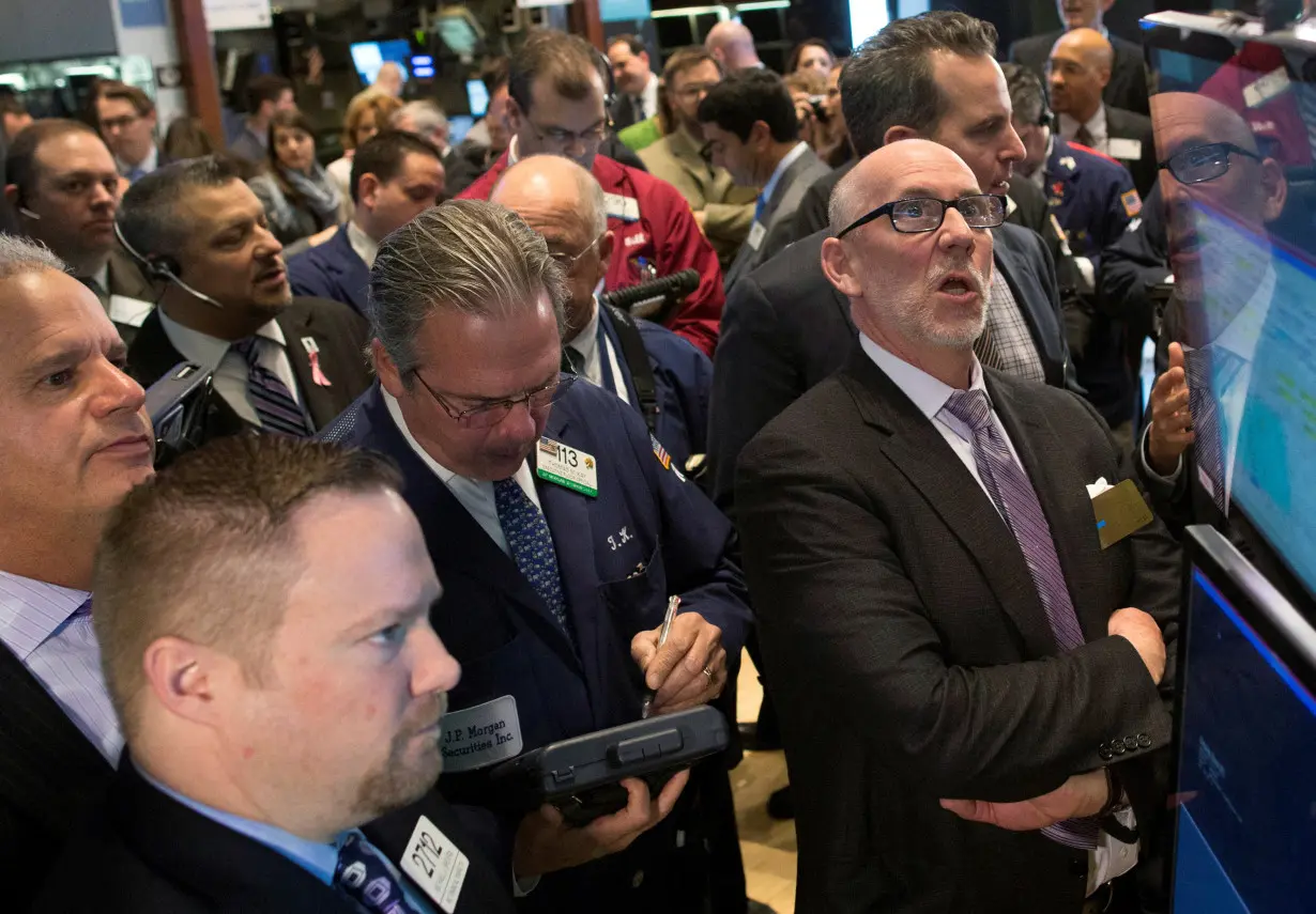 FILE PHOTO: Invitae Corporation CEO Randy Scott looks up at the price for his company during the IPO on the floor of the New York Stock Exchange