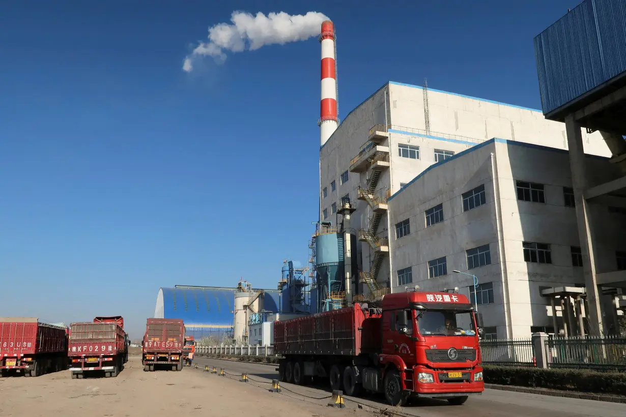 FILE PHOTO: Truck passes by a chemical factory near the Jinjie Industrial Park in Shenmu