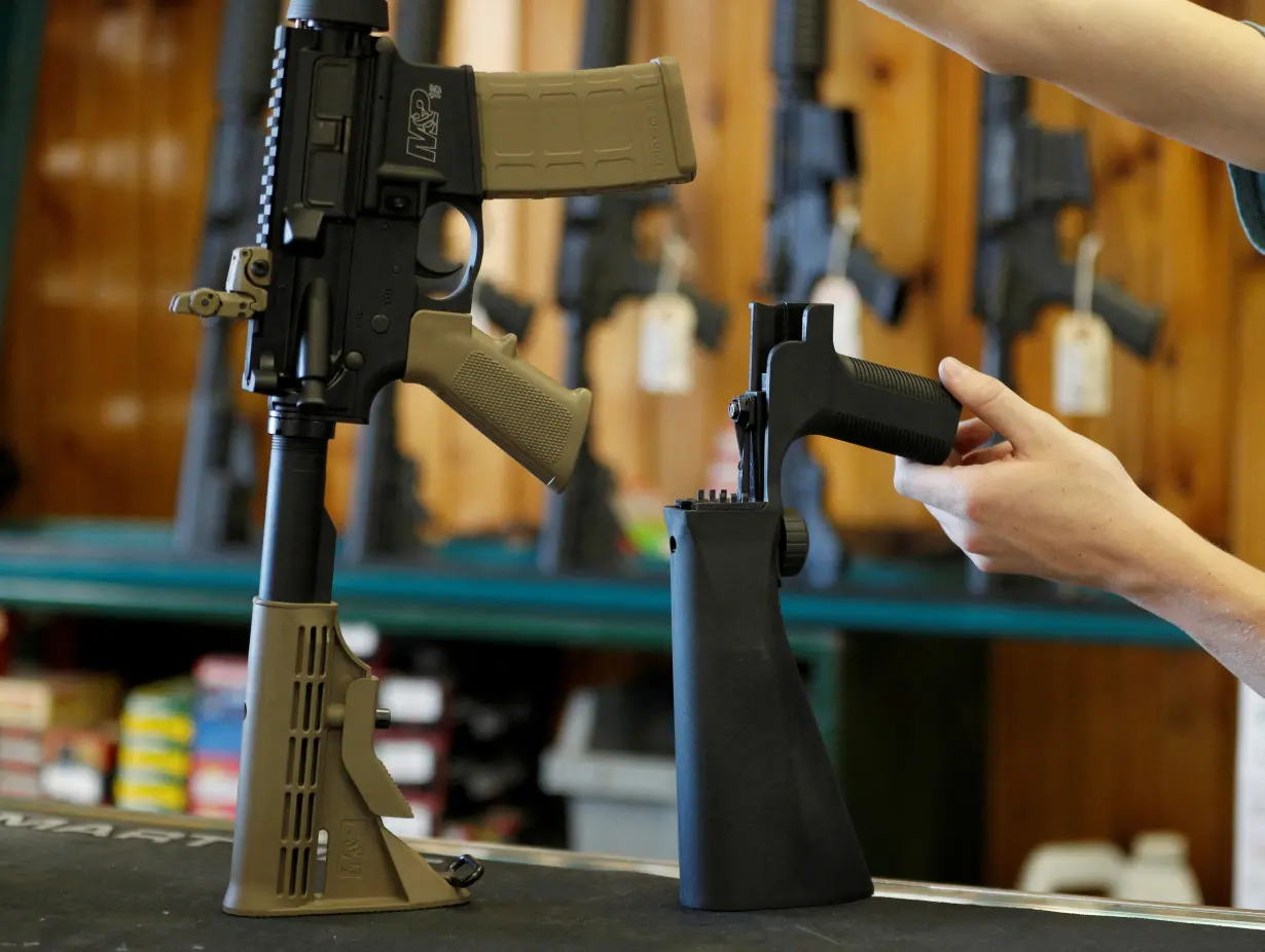 FILE PHOTO: A bump fire stock that attaches to a semi-automatic rifle to increase the firing rate is seen at Good Guys Gun Shop in Orem