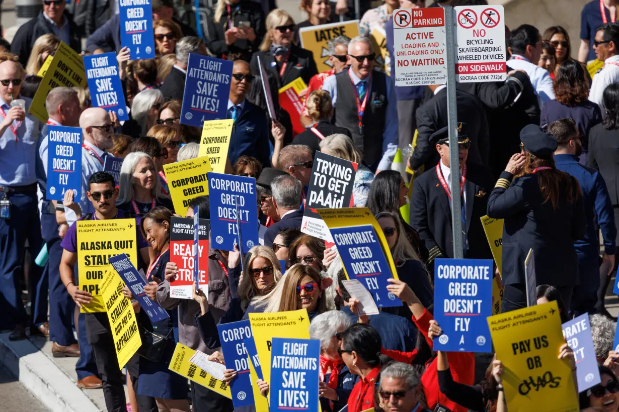 Flight attendants join hands to picket outside 30 airports for better pay