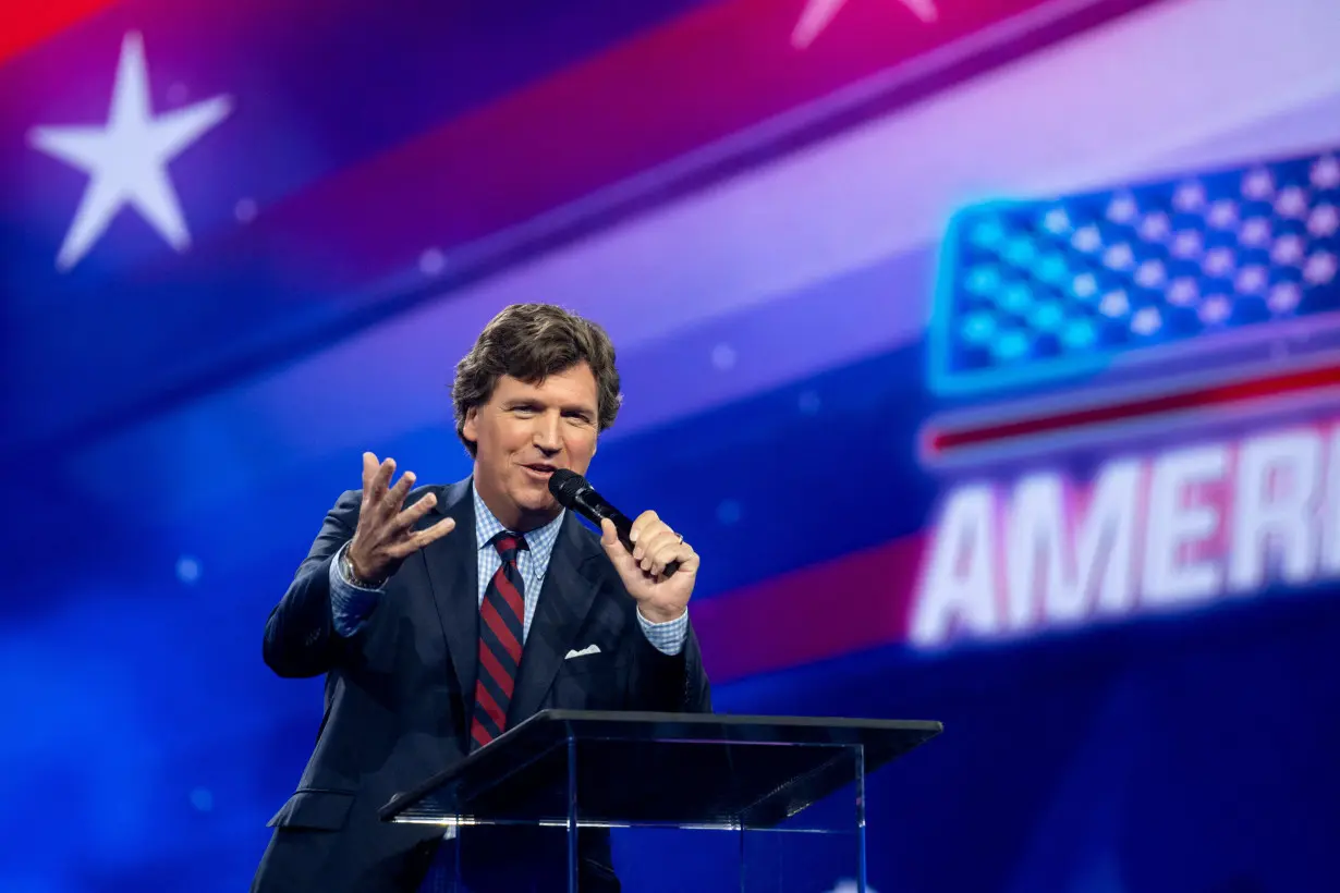 Tucker Carlson speaks as conservative leaders and personalities attend Turning Point USA's AmericaFest 2023 in Phoenix