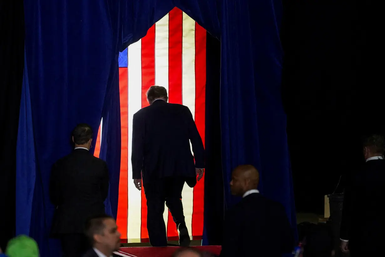 FILE PHOTO: Republican presidential candidate and former U.S. President Donald Trump holds a rally ahead of the New Hampshire primary election in Manchester, New Hampshire