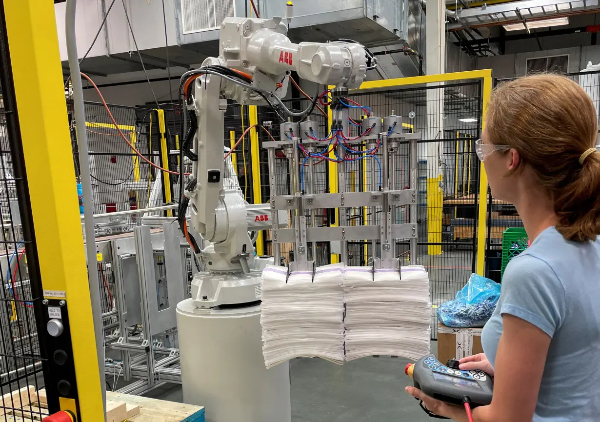 FILE PHOTO: A researcher works on a robot at P&G's CoRE Fabric and Home Care laboratory in Cincinnati