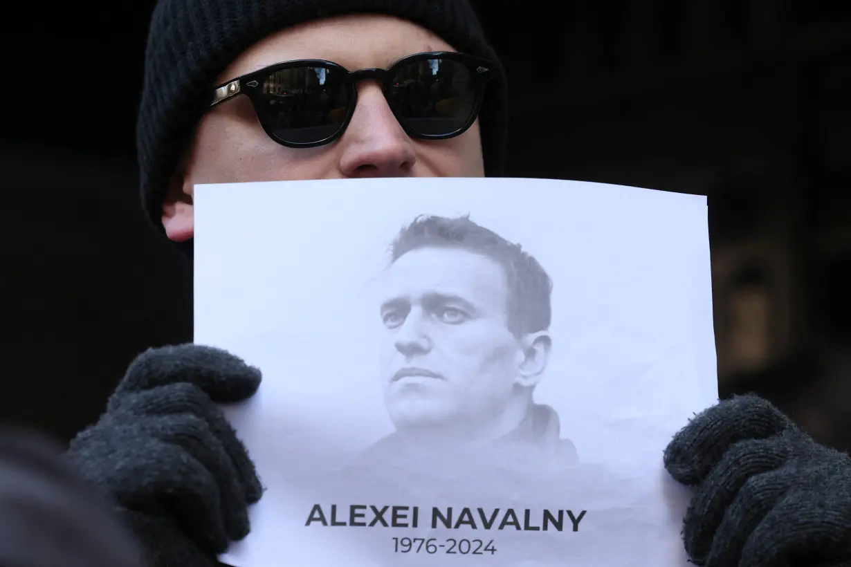 People attend a vigil after the death of Alexei Navalny, outside the Russian consulate in New York