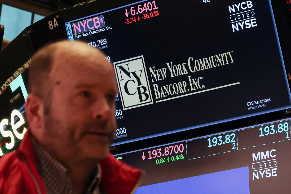 A screen displays the trading information for New York Community Bancorp on the the NYSE in New York