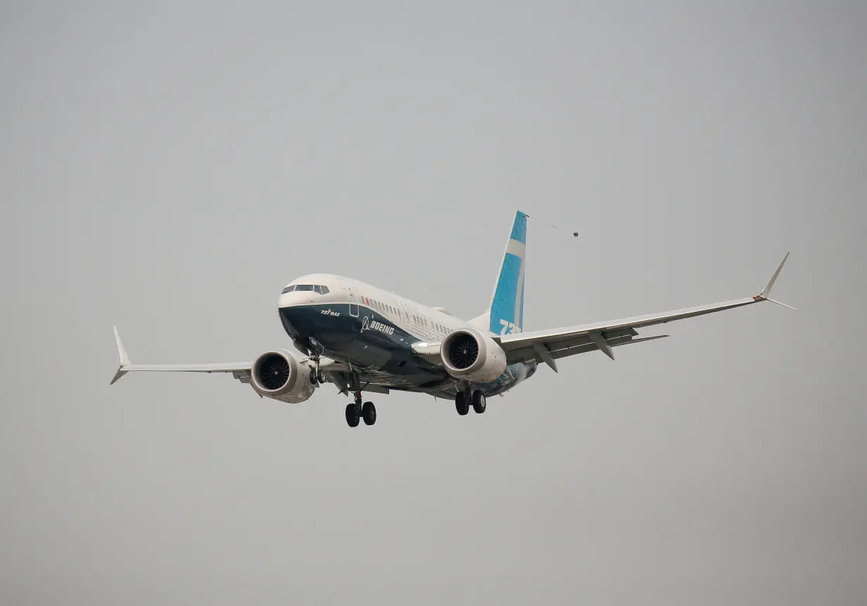 FILE PHOTO: A Boeing 737 MAX aircraft lands during an evaluation flight in Seattle