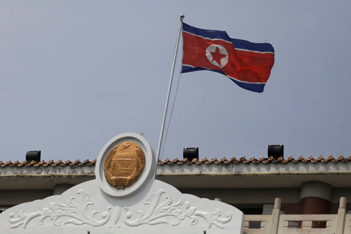 FILE PHOTO: The North Korean flag flutters at the North Korea consular office in Dandong