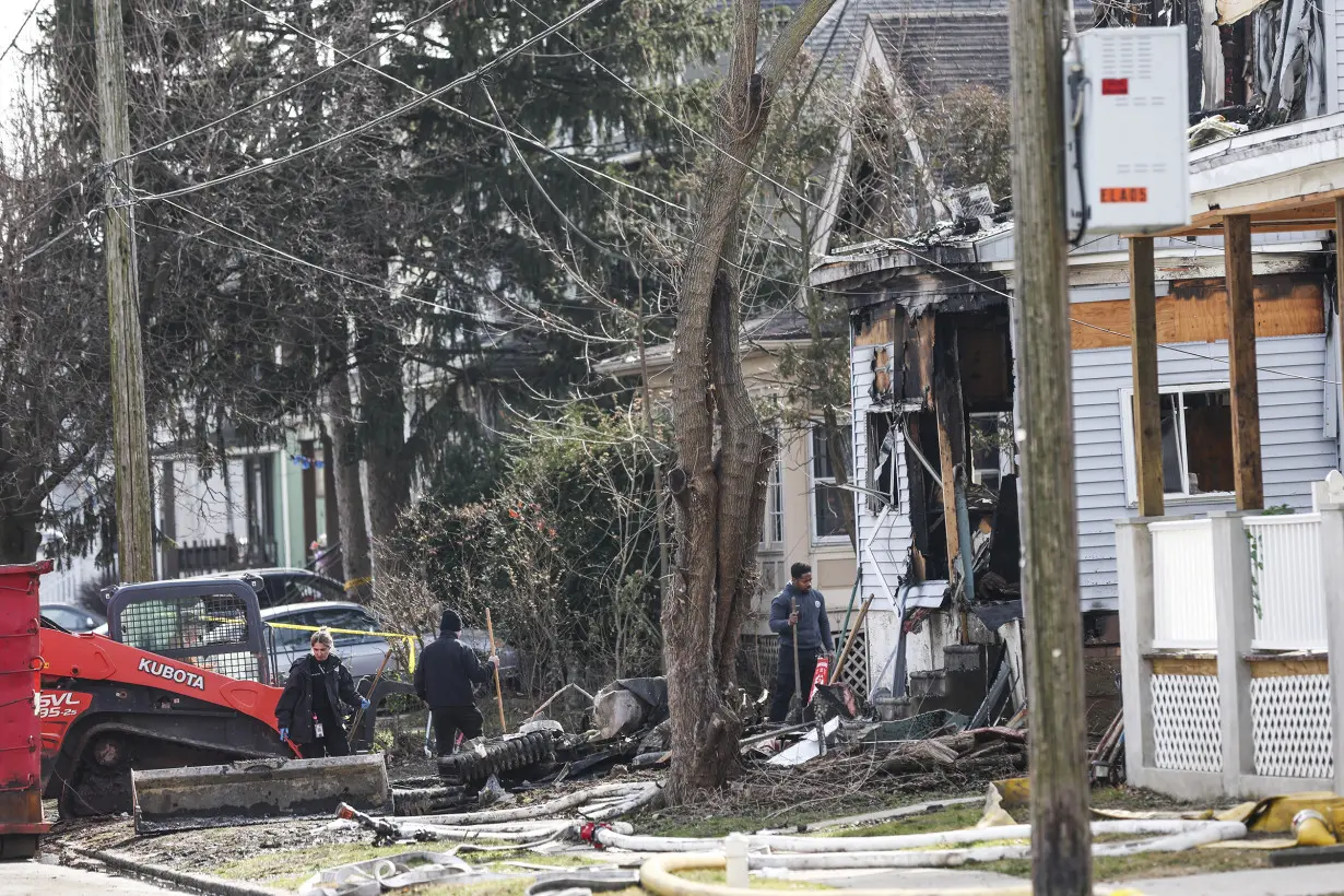 Investigators focus on suspect in Philadelphia area fire and shooting that left 6 dead, 2 hurt