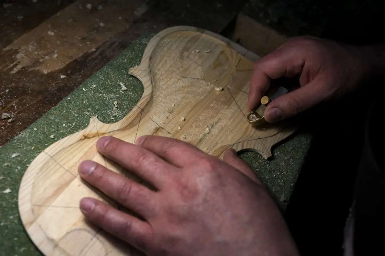 Italian inmates attend La Scala concert featuring violins they made from smugglers' boats