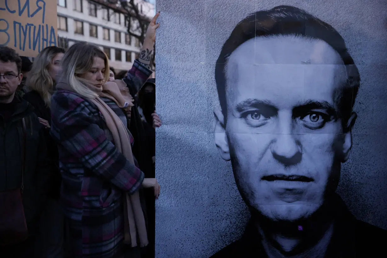 People demonstrate following the death of Russian opposition leader Alexei Navalny, in Warsaw