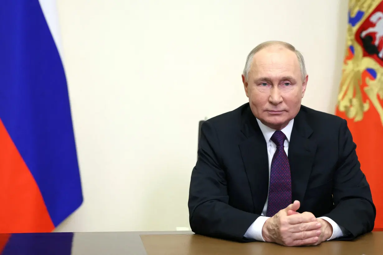 Russian President Putin delivers a video address to mark the 31st anniversary of the founding of Gazprom, outside Moscow