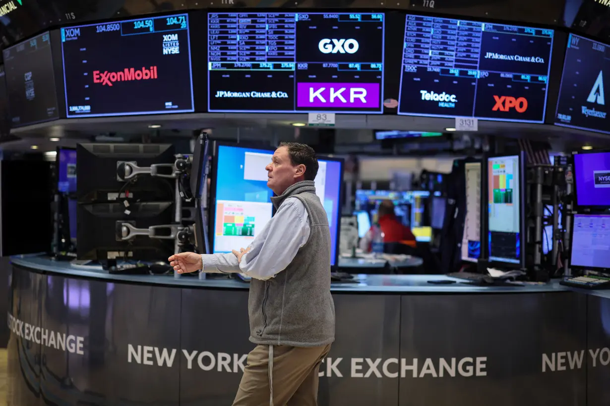 Traders work on the floor of the NYSE in New York