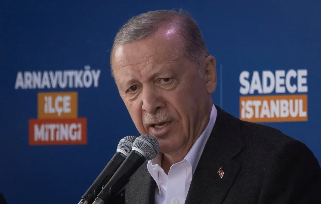 Turkish President Tayyip Erdogan addresses his supporters during a rally ahead of the local elections in Istanbul