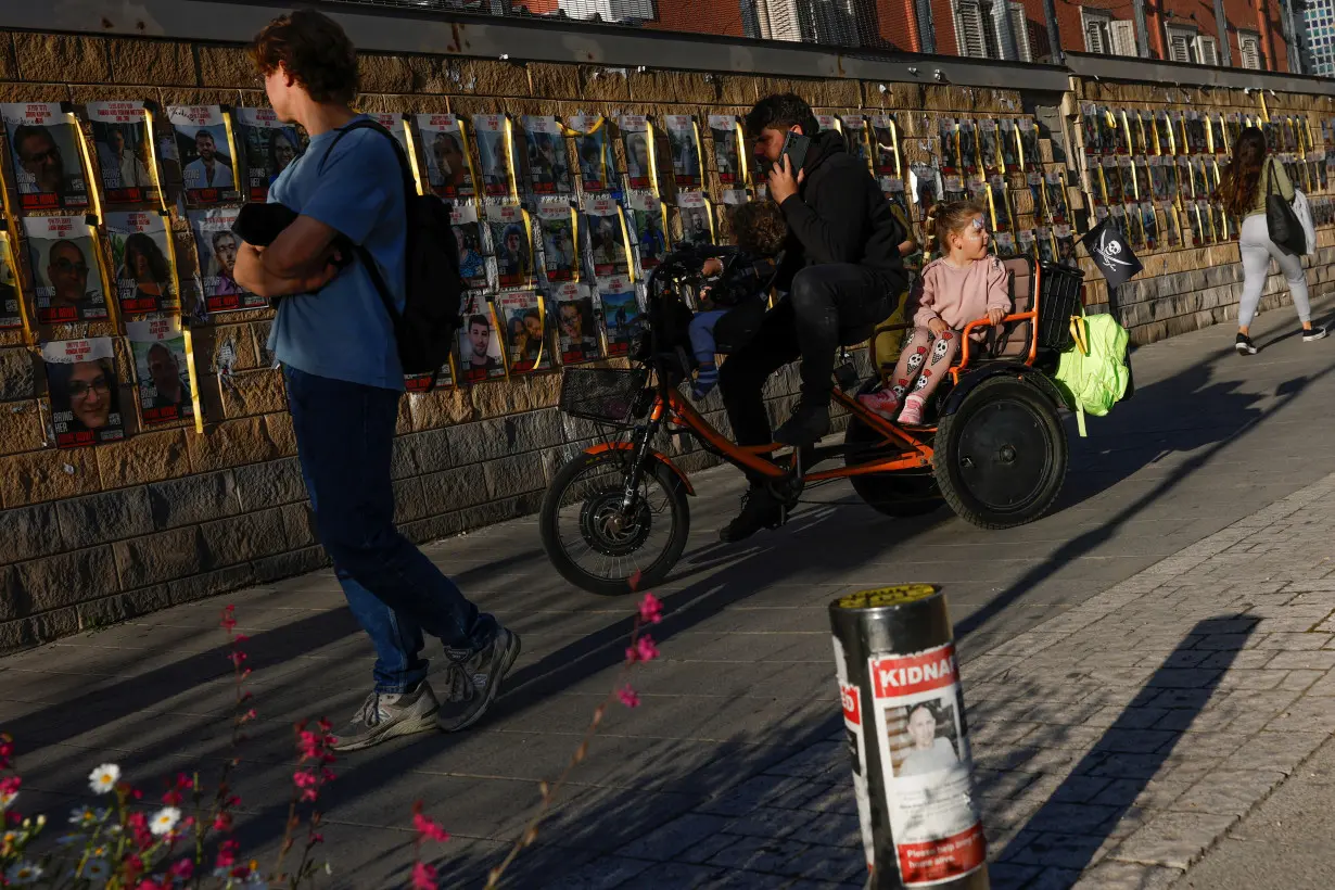 Posters with photos of hostages kidnapped in the deadly October 7 attack, in Tel Aviv